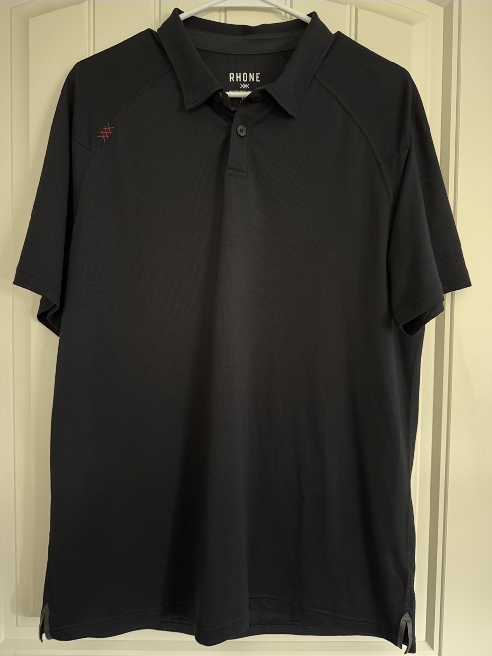 RHONE Black Performance Polo with Subtle Logo